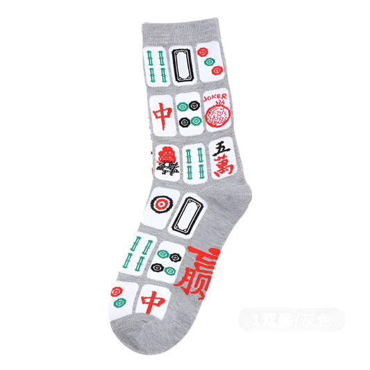 Gray mahjong-themed crew sock featuring colorful mahjong tile designs with Chinese characters and traditional symbols in red, green, black, and white.