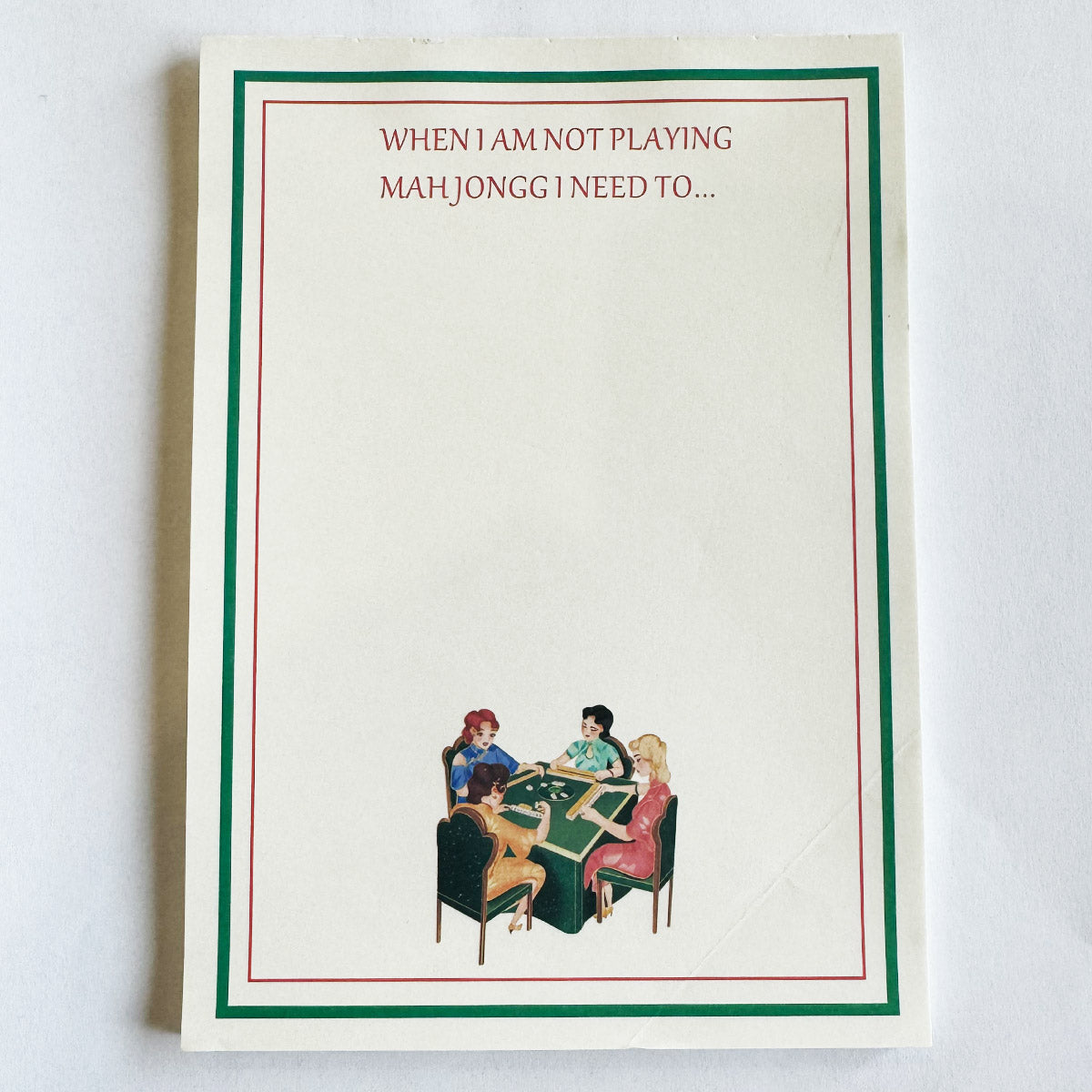 Mahjong-themed to-do list notepad featuring the phrase "When I Am Not Playing Mah Jongg I Need To..." with a red and green border and a vintage illustration of four women playing mahjong at the bottom.