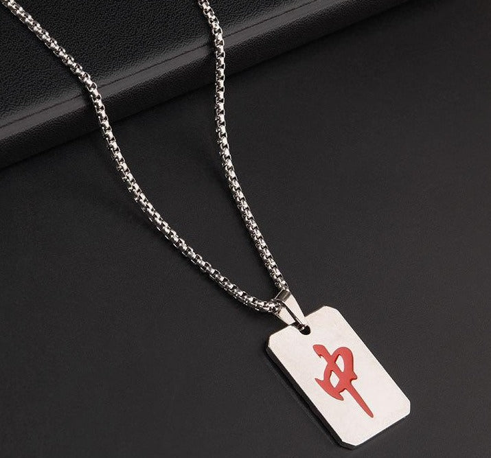Silver-tone mahjong-themed necklace featuring a rectangular white pendant with a red Chinese character representing the Red Dragon mahjong tile, suspended from a silver chain.
