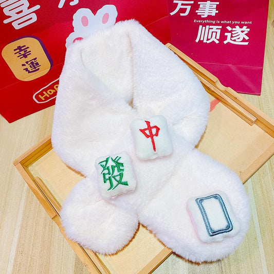 White fluffy mahjong-themed scarf featuring plush mahjong tile patches with Green Dragon, Red Dragon, and blank tile designs in green, red, and blue.